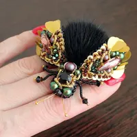 Объемная брошь из меха и вышивки бисером